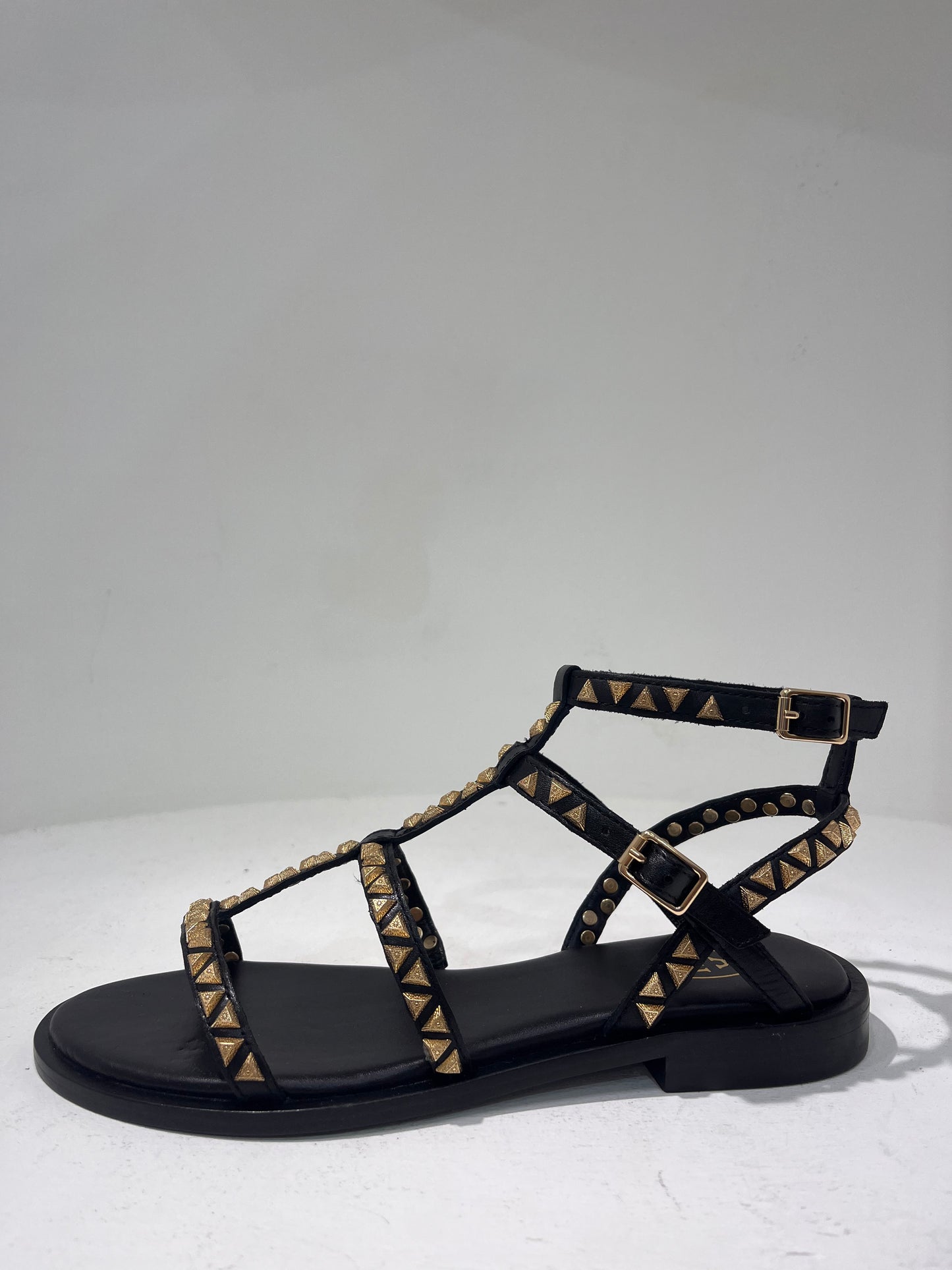 A Pandora01 gold triangle stud gladiator sandals