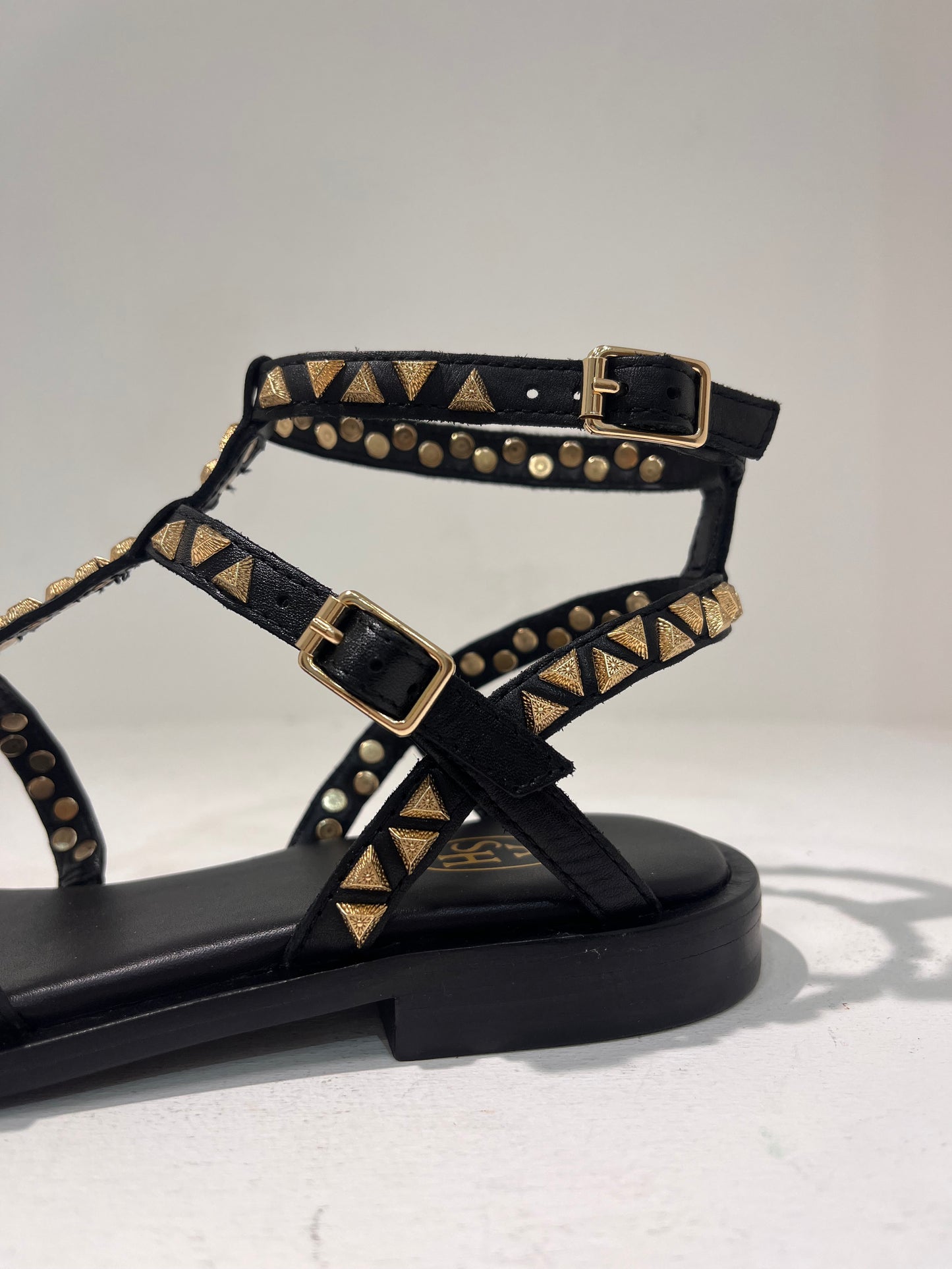 A Pandora01 gold triangle stud gladiator sandals