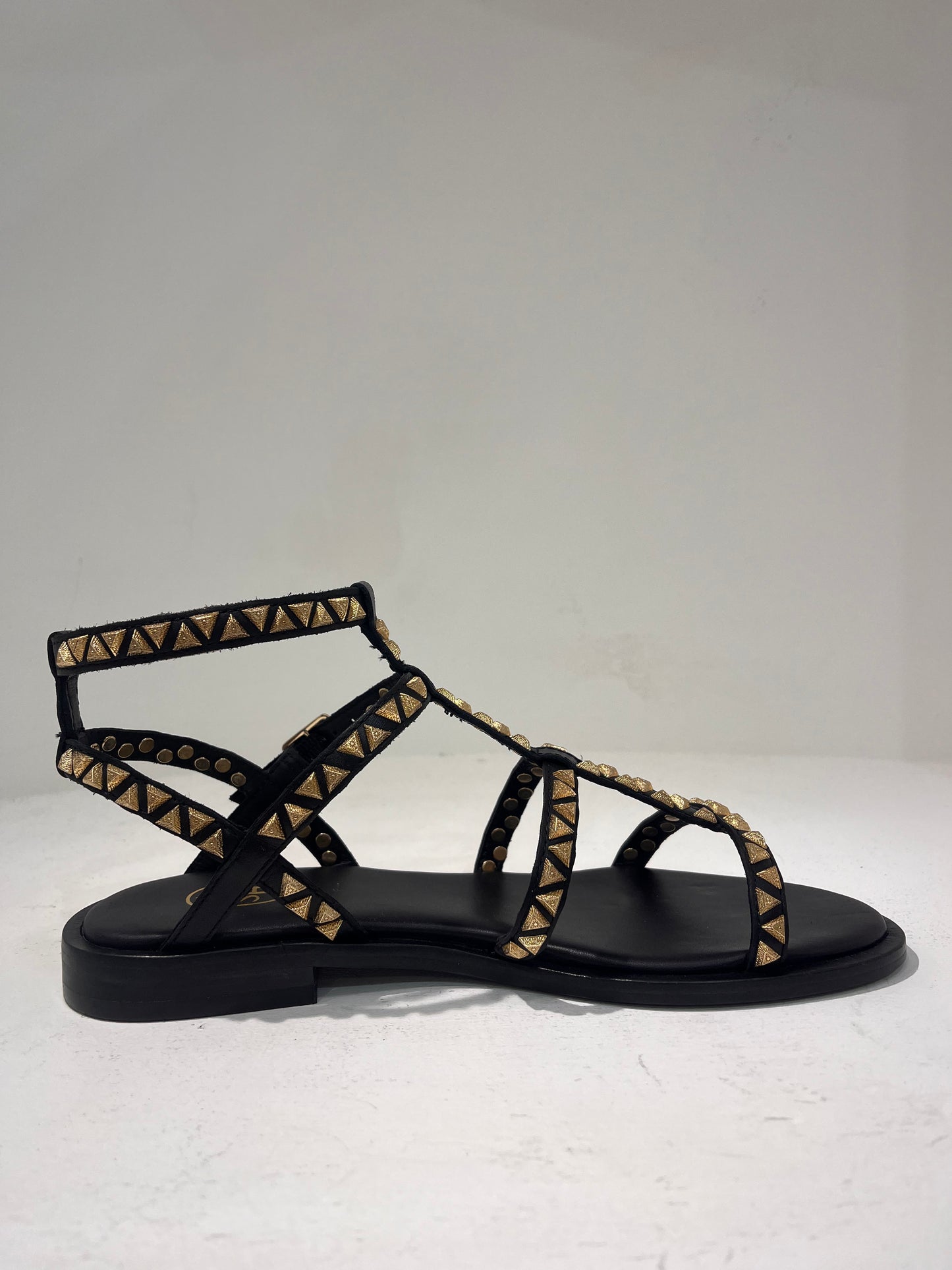 A Pandora01 gold triangle stud gladiator sandals
