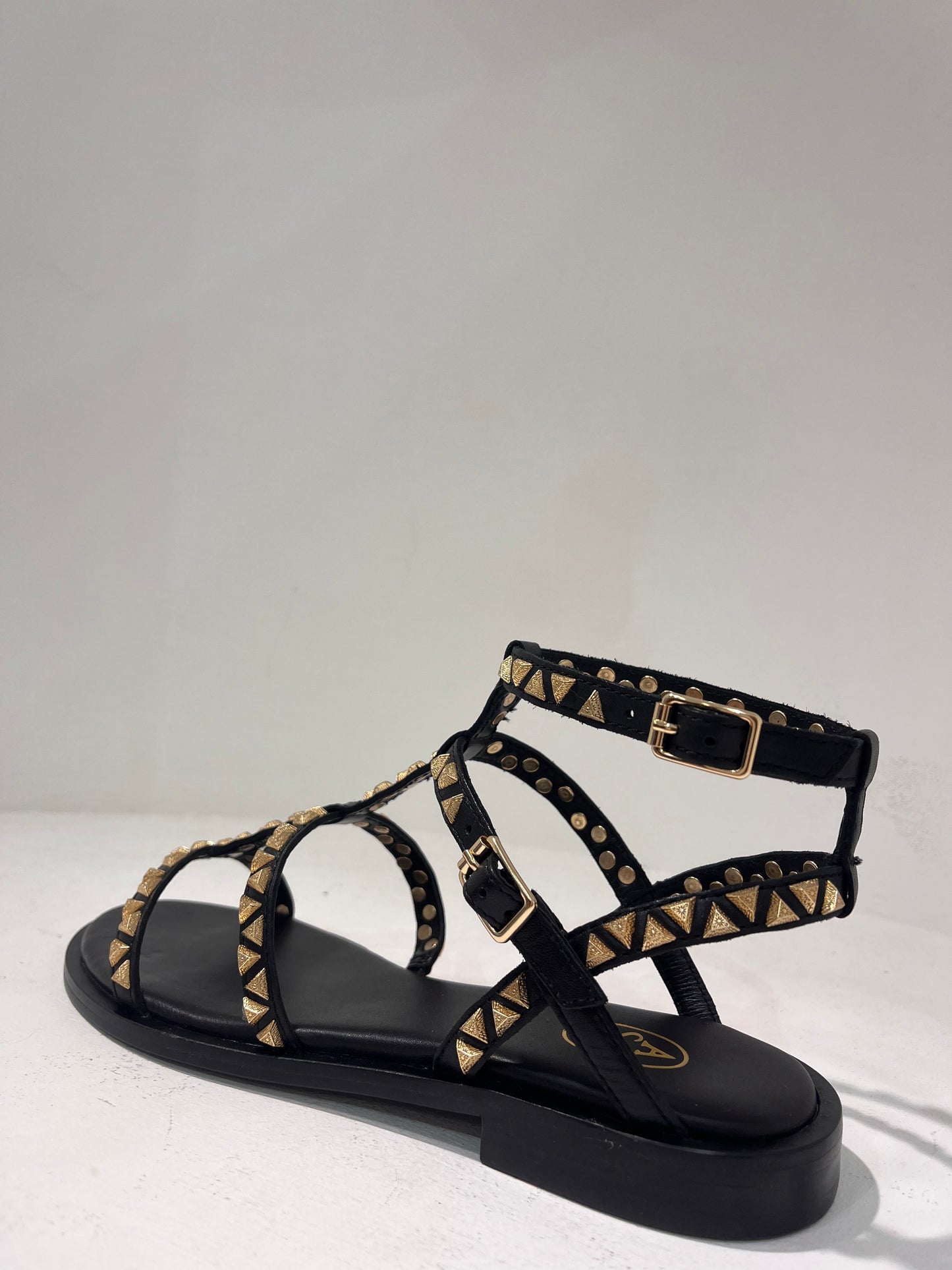 A Pandora01 gold triangle stud gladiator sandals