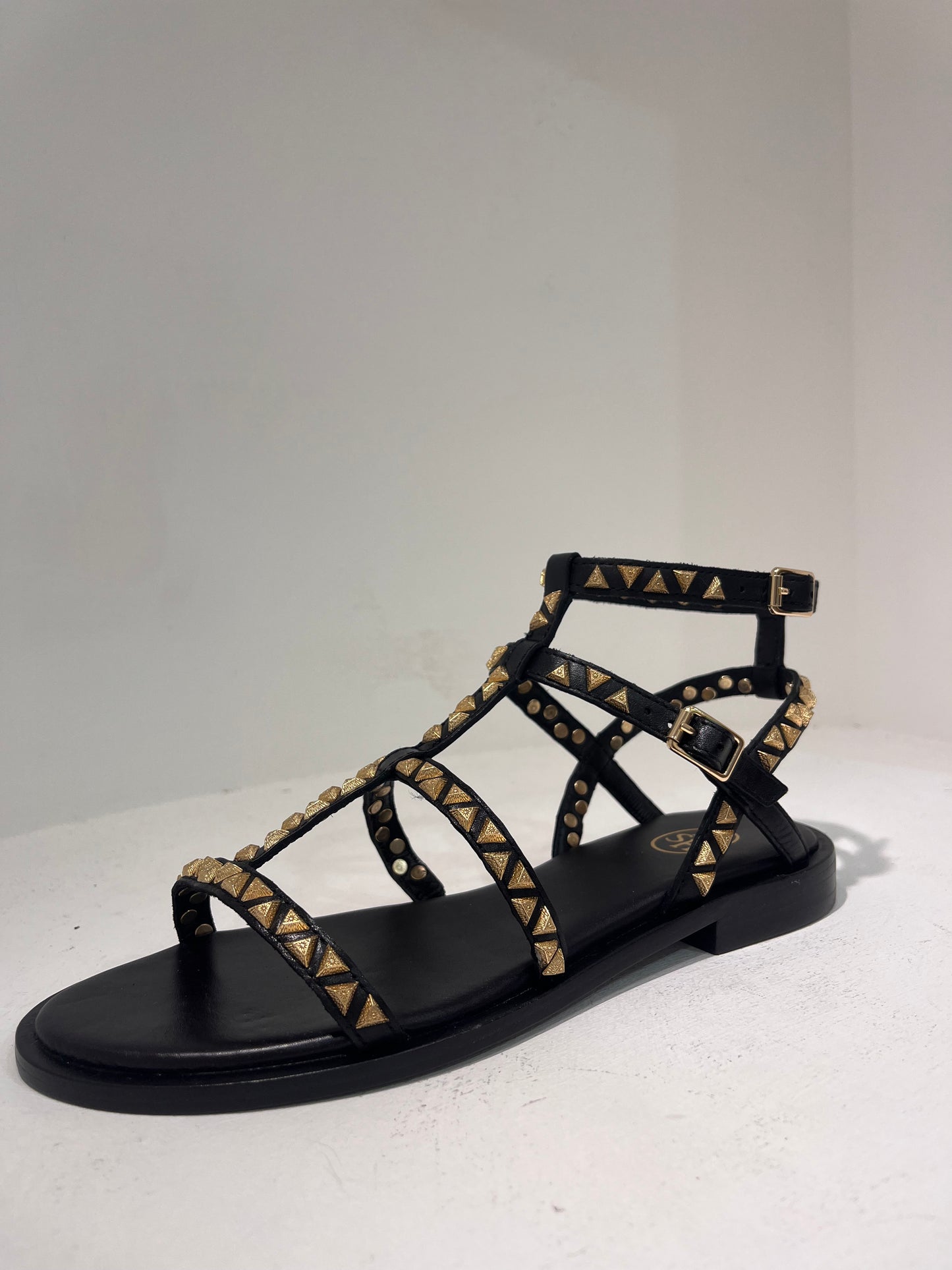 A Pandora01 gold triangle stud gladiator sandals